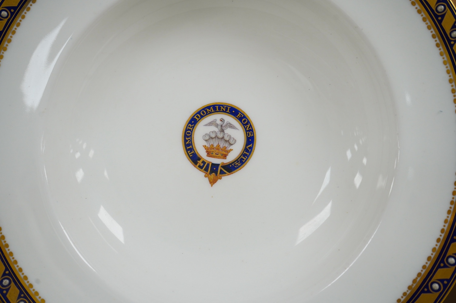 A pair of Minton armorial porcelain soup dishes with Latin motto, 25cm in diameter. Condition - good